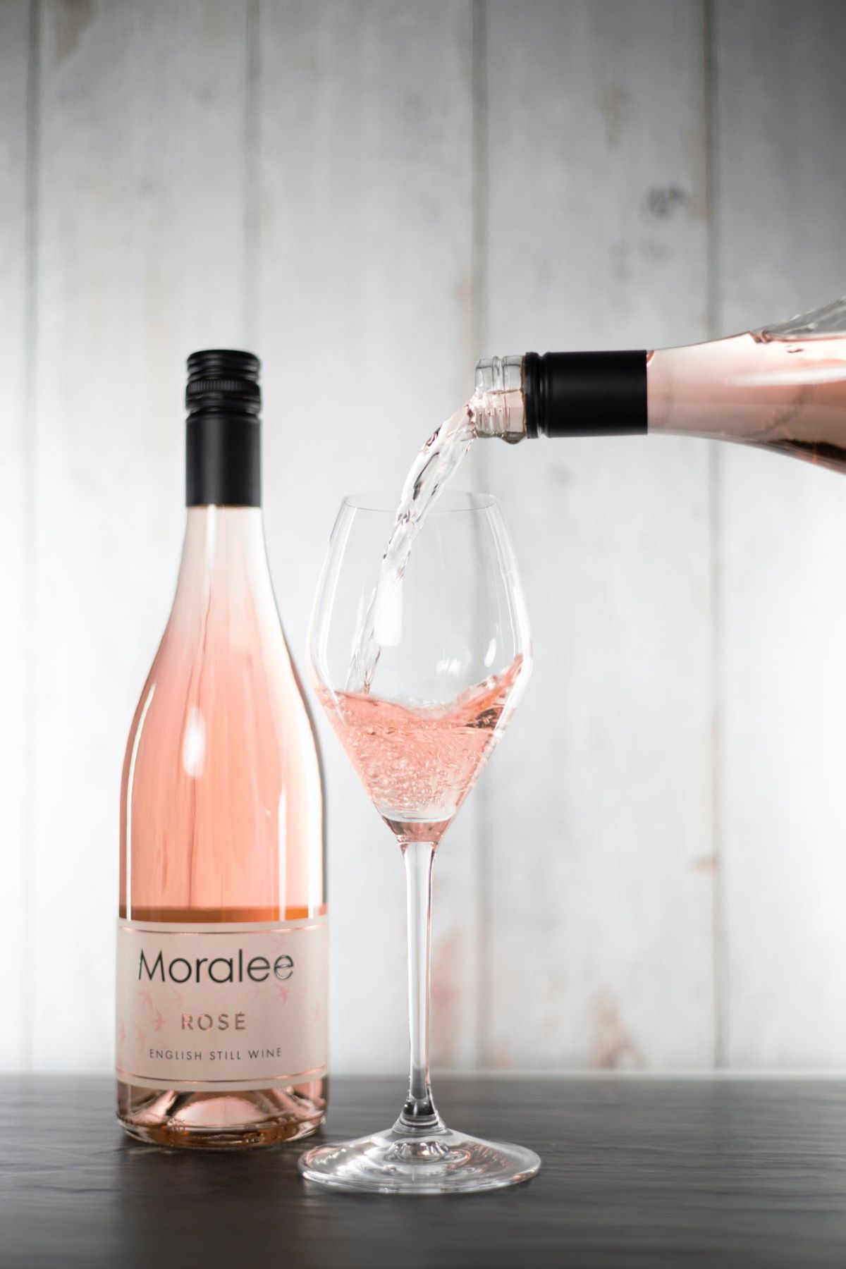 Moralee still rosé being poured into a glass beside the bottle